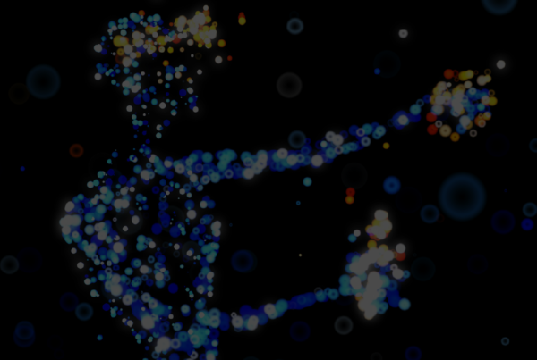 Sagoma di una persona che utilizza un visore e i joystick fatta da luci e sfondo scuro per rappresentare un uomo che si trova nel metaverso